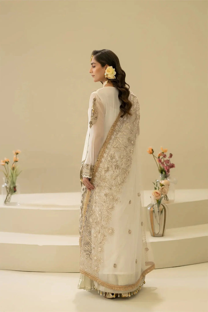 Back view of M-109 OFF-WHITE Pakistani dress with detailed embroidery on dupatta and sleeves, showcasing traditional craftsmanship.