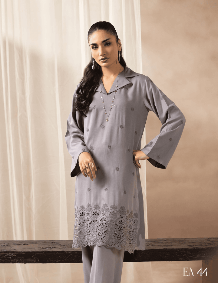 Close-up of RANGREZA EA-44-38 grey two piece suit highlighting floral embroidery on kurta hem, ideal for winter wear from Pakistani fashion brand.