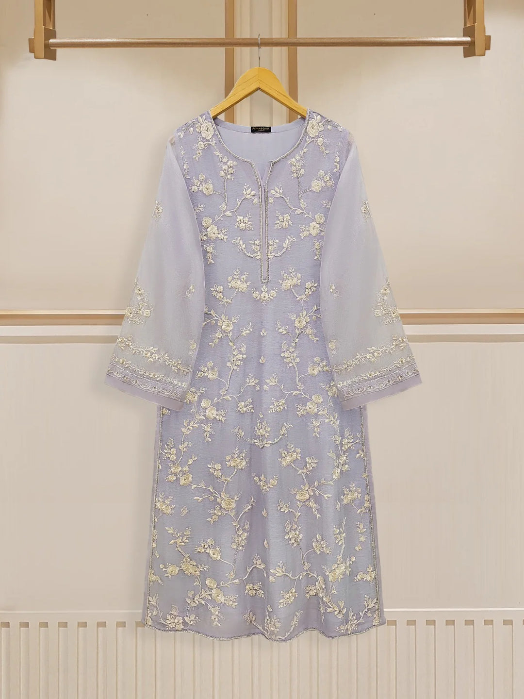 Elegant embroidered cotton net shirt on hanger