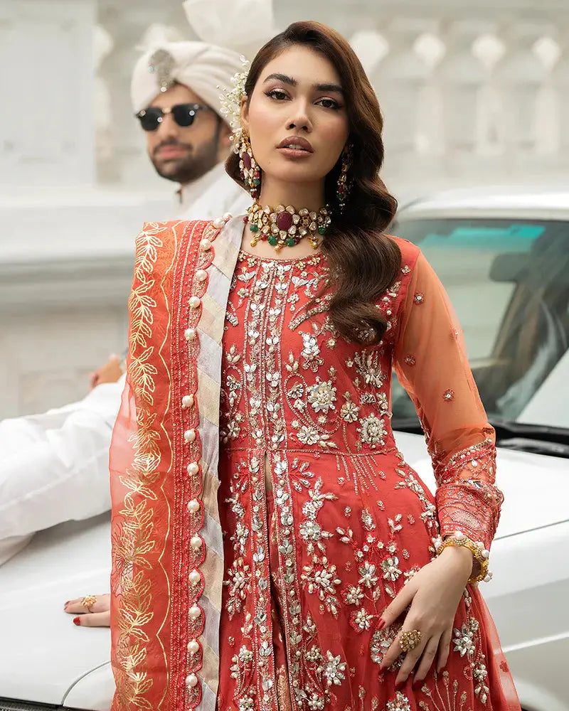 Close-up of AROOSH Wedding Wear AR-103-2200 showing intricate embroidery on the red peplum and organza dupatta. A luxurious choice for Pakistani wedding attire.