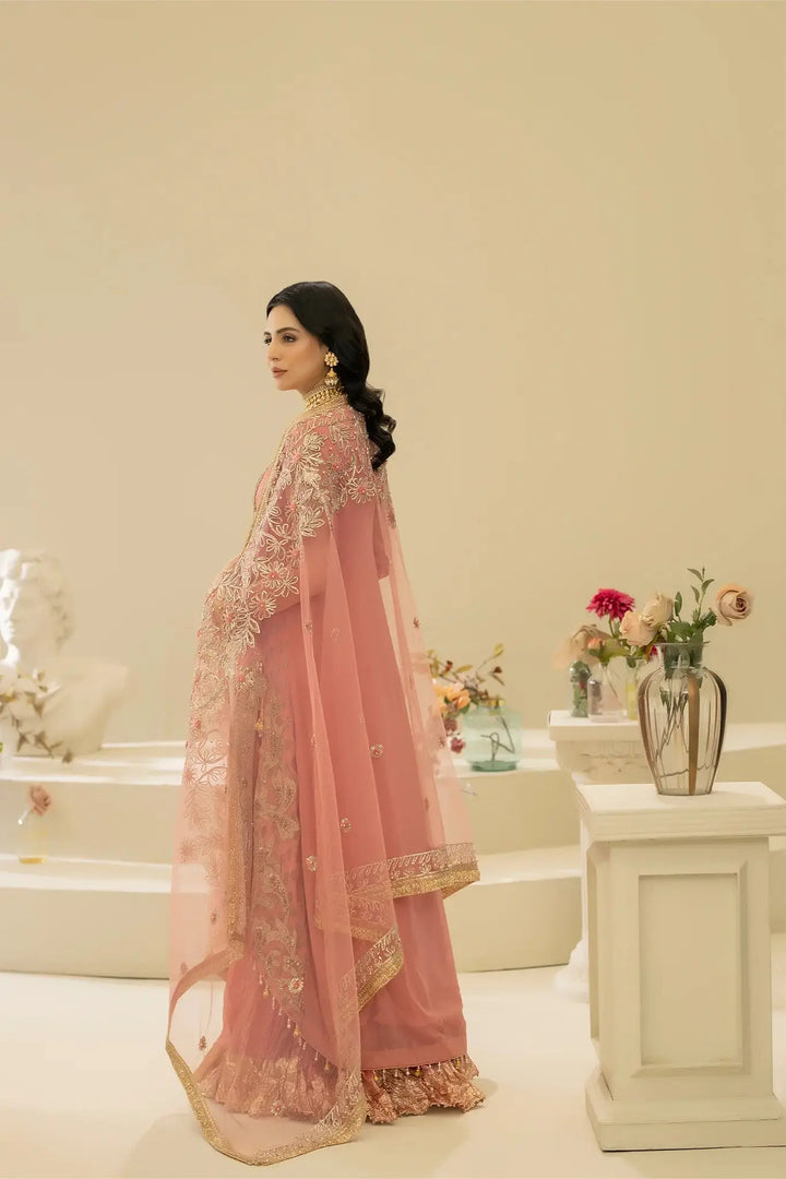 Back view of KHUDA BAKSH M-109 Pink with sheer net dupatta and floral embellishments, elegant Pakistani formal outfit.