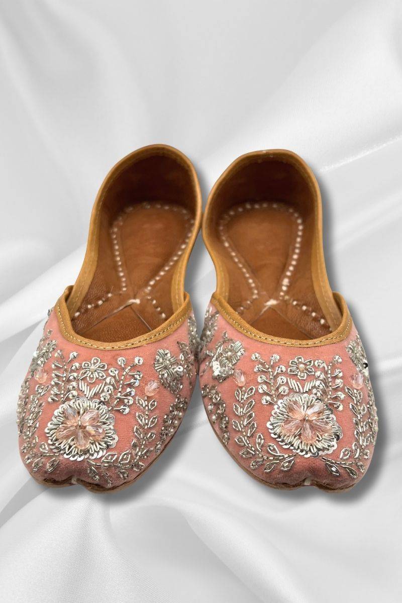 Front view of Nawab Pink Jutti featuring floral silver embroidery on soft pink velvet, perfect for traditional or pastel outfits.
