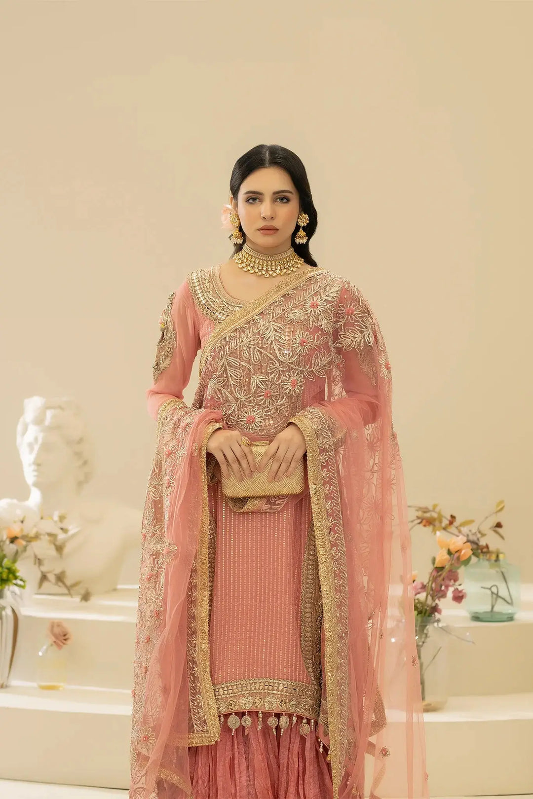 Front pose of model in KHUDA BAKSH M-109 Pink, highlighting ornate embroidery and luxurious fabric details.