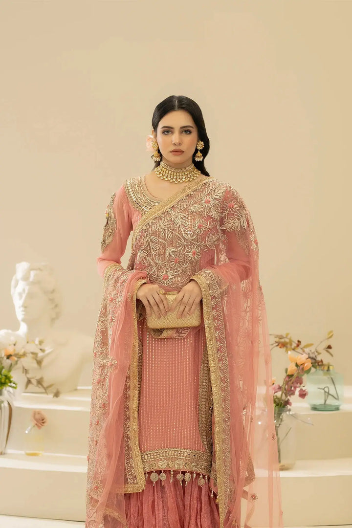 Front pose of model in KHUDA BAKSH M-109 Pink, highlighting ornate embroidery and luxurious fabric details.