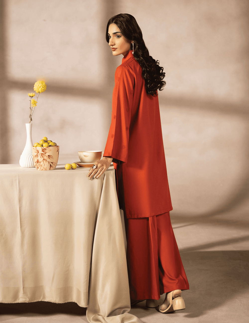 Back view of RANGREZA EA-50-3805 orange pakistani two piece suit showing flowy kurta and matching trousers, perfect for casual daily outfits.