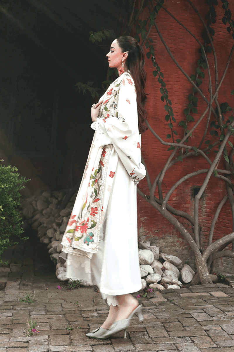 Rangreza AL-1125 Pakistani suit side view showcasing intricate embroidery on white Dhanak shirt and vibrant floral printed wool shawl.