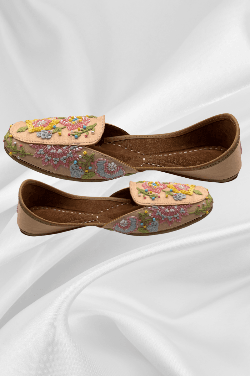 Side profile of Rangrez Peach Jutti - Traditional Pakistani leather flats with pastel floral embroidery and soft peach tones for stylish ethnic wear.