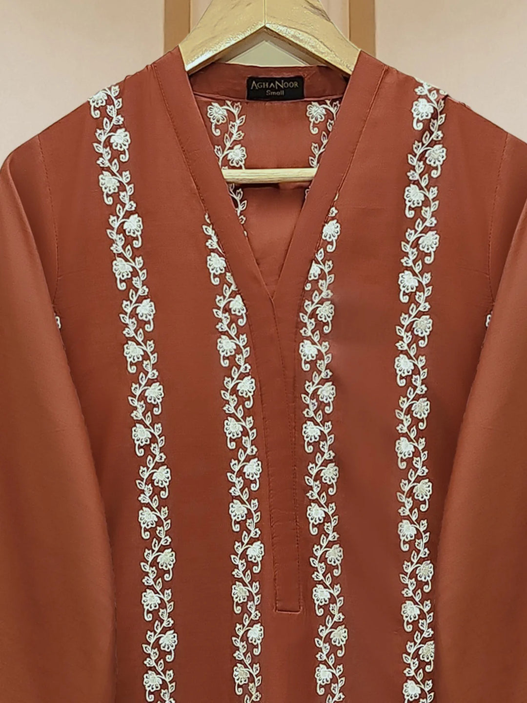 Close-up of embroidered neckline on lawn suit