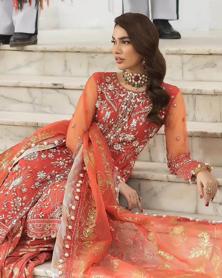 AROOSH AR-103-2200 wedding ensemble featuring a red embroidered shirt and ghararah with sheer organza dupatta. A regal look for festive Pakistani occasions.