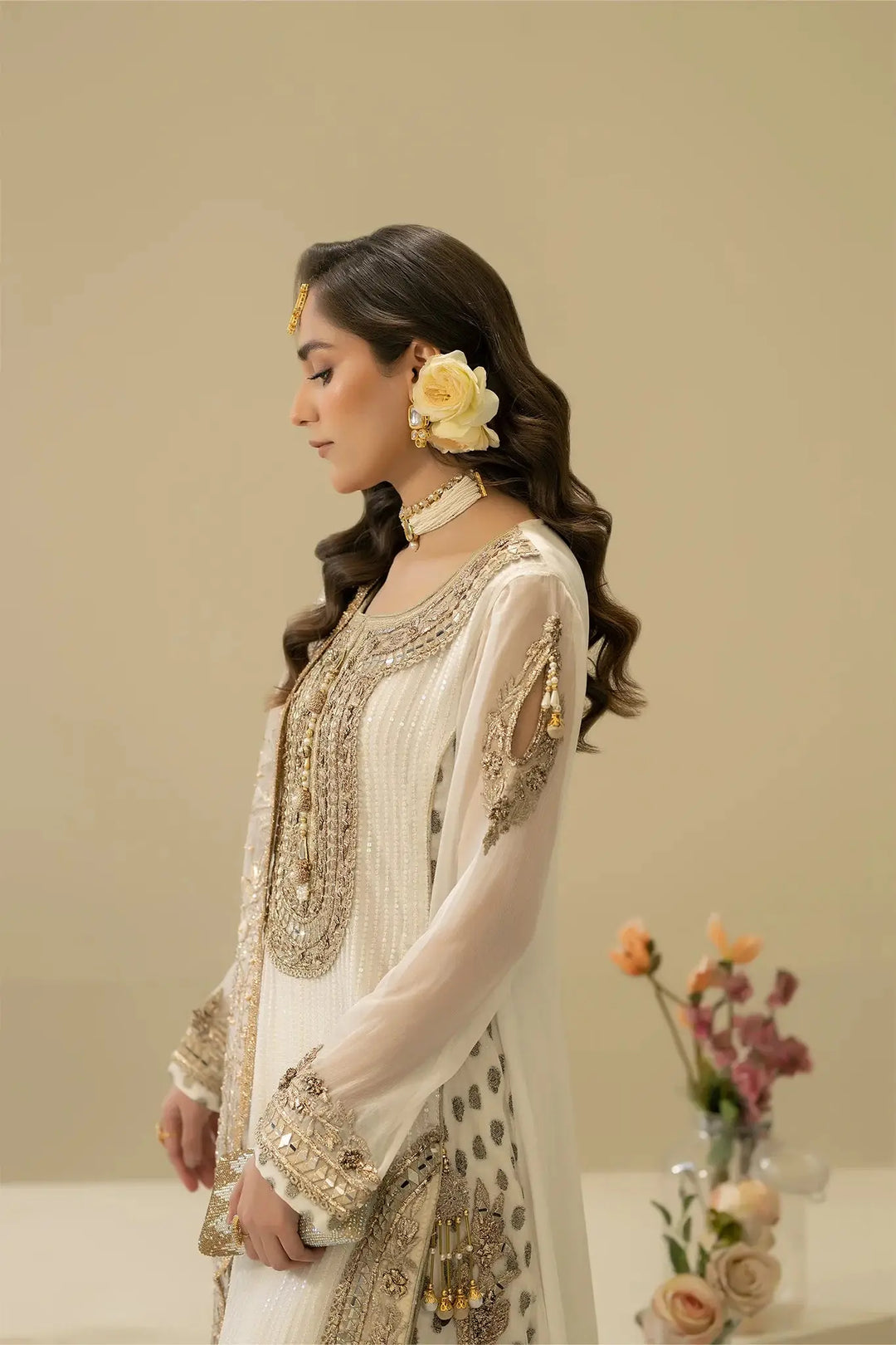 Side profile of M-109 OFF-WHITE Pakistani outfit with detailed embellishments and sheer sleeves, ideal for elegant occasions.