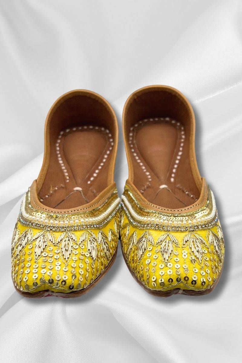 Front view of Zeenat Yellow Jutti - traditional Pakistani Khussa with gold embellishments and pearl detailing, ideal for ethnic and festive outfits.