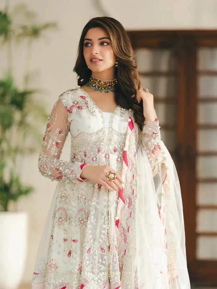 Embroidered white net shirt with sequin, pearl, and chainwork embellishments, paired with a matching dupatta, designed for wedding wear