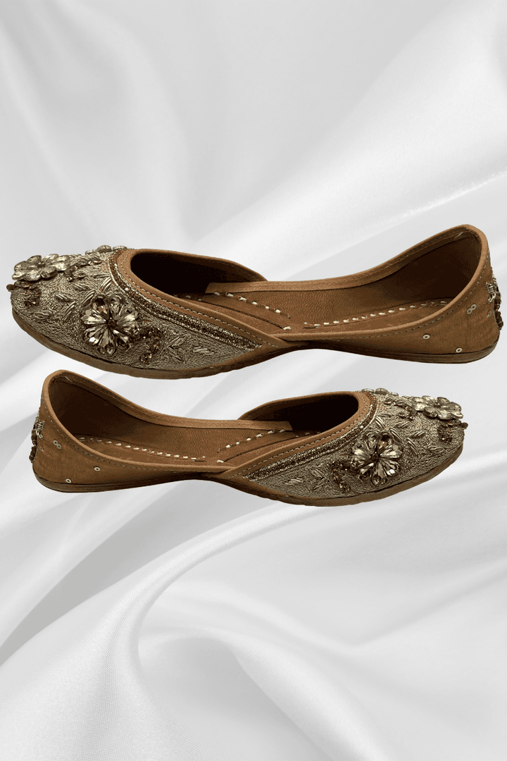 Side profile of Sajawat Golden Jutti showcasing soft inner padding and ornate floral design, stylish flat footwear for women.