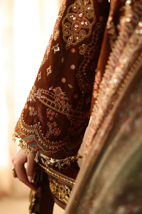 Model wearing embroidered velvet dress with jewelry and accessories