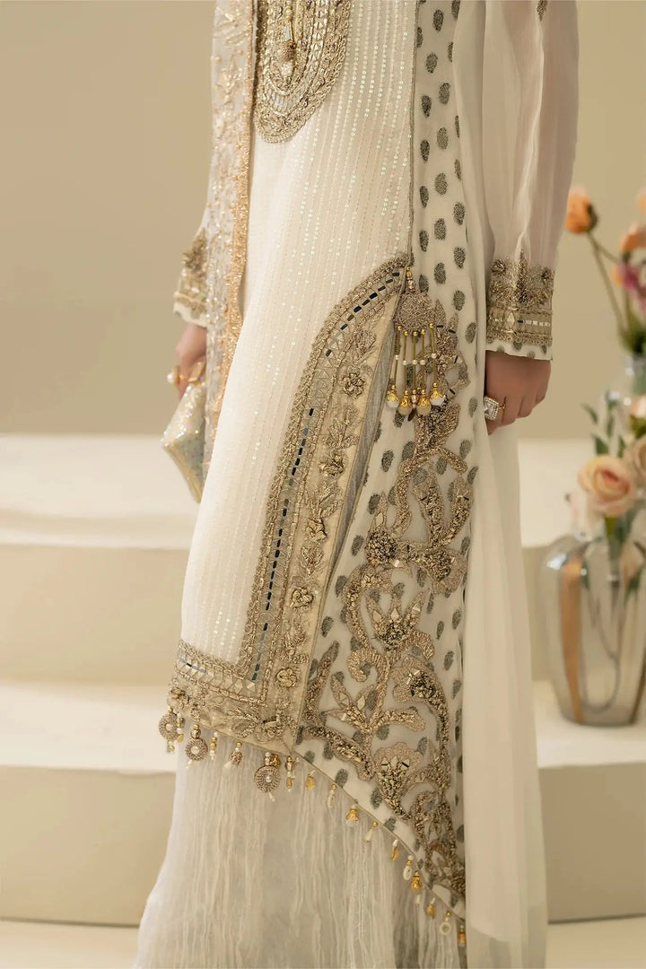Detailed close-up of M-109 OFF-WHITE shirt hem with gold embroidery, pearls, and gota work, showcasing premium Pakistani fashion.
