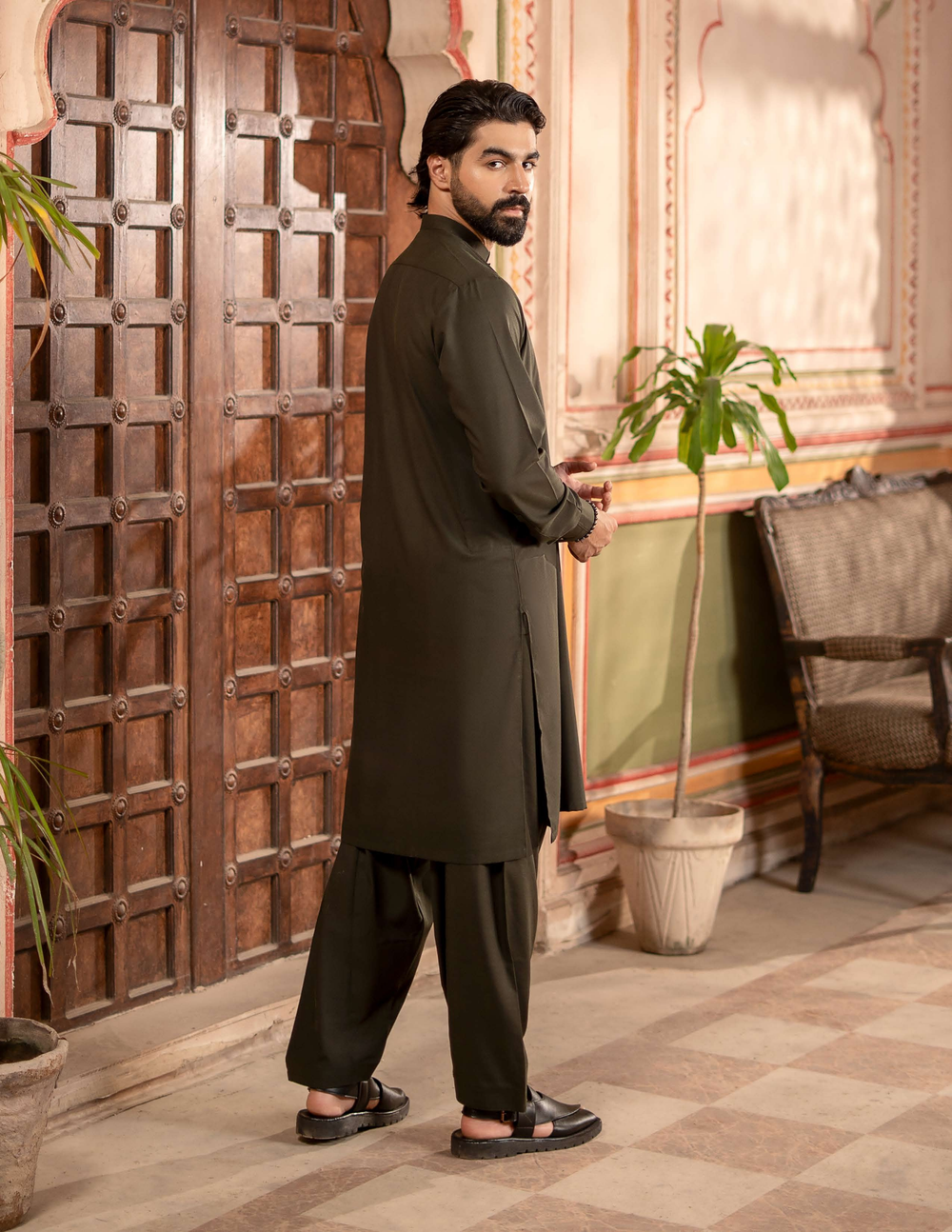Back view of RANGREZA MA-98 eid clothing for men, featuring dark brown kameez shalwar with traditional tailoring and modern silhouette.