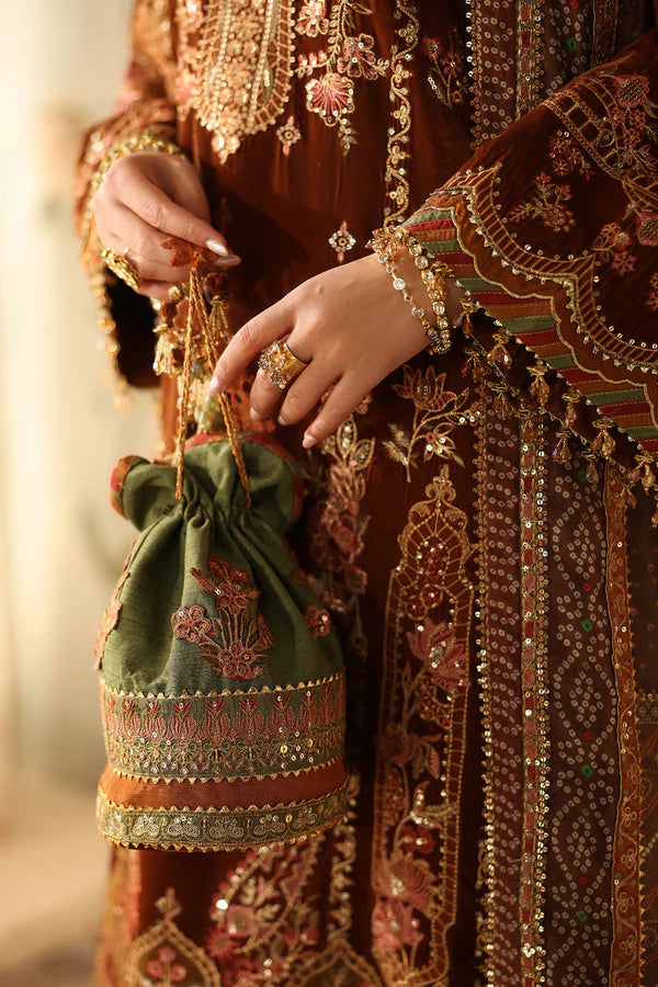 Detailed embroidery on velvet dress with jewelry and accessories
