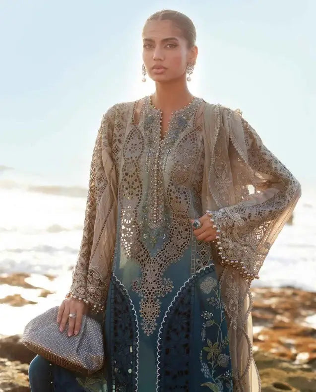 Close-up of LUXURY Women's 3 Piece Suit AL-4303 showcasing detailed embroidery on lawn shirt with chiffon dupatta and cambric pants.