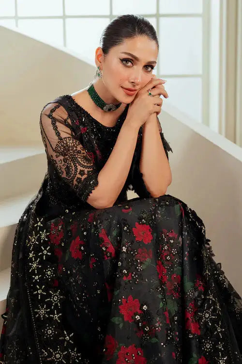 Seated portrait of model in Rangreza 3 Piece stitched outfit AL-4199 showcasing floral embroidery and luxurious net fabric.