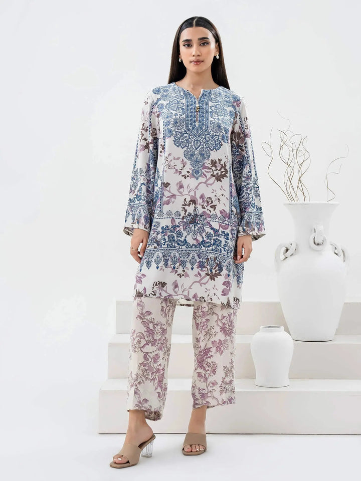 Limelight Grip Co-Ord Set-Printed (Pret) featuring a floral and intricate blue and purple design on a white base, styled with a long shirt and matching trousers.