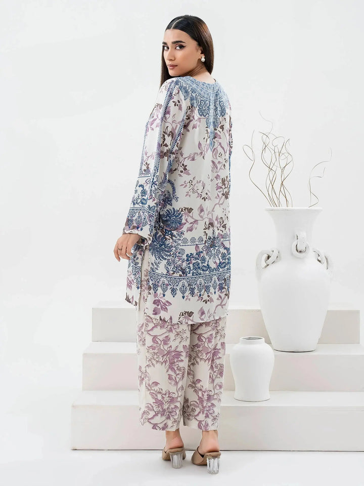 Back view of Limelight Grip Co-Ord Set-Printed (Pret) highlighting the elegant floral and intricate blue and purple prints on the long shirt and trousers.