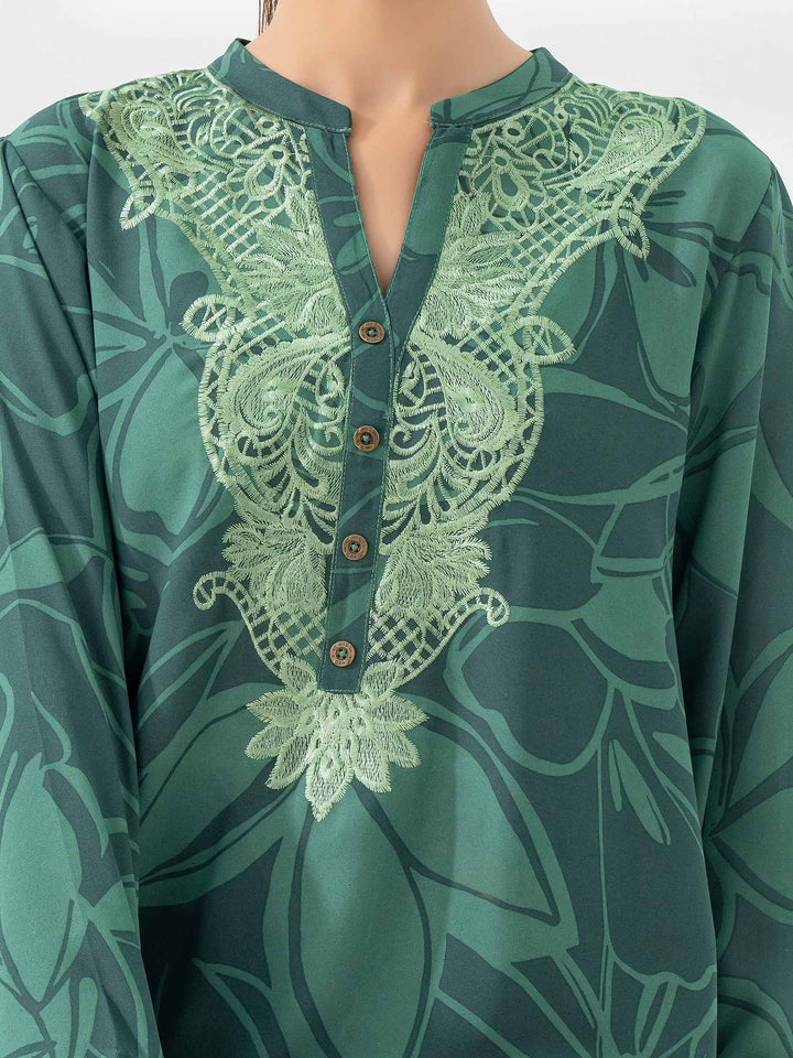 Detailed view of the embroidered neckline on Limelight's green floral printed co-ord set with button embellishments.