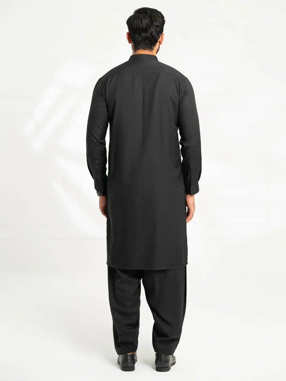 Back view of men's black kurta with embroidered details, traditional clothing