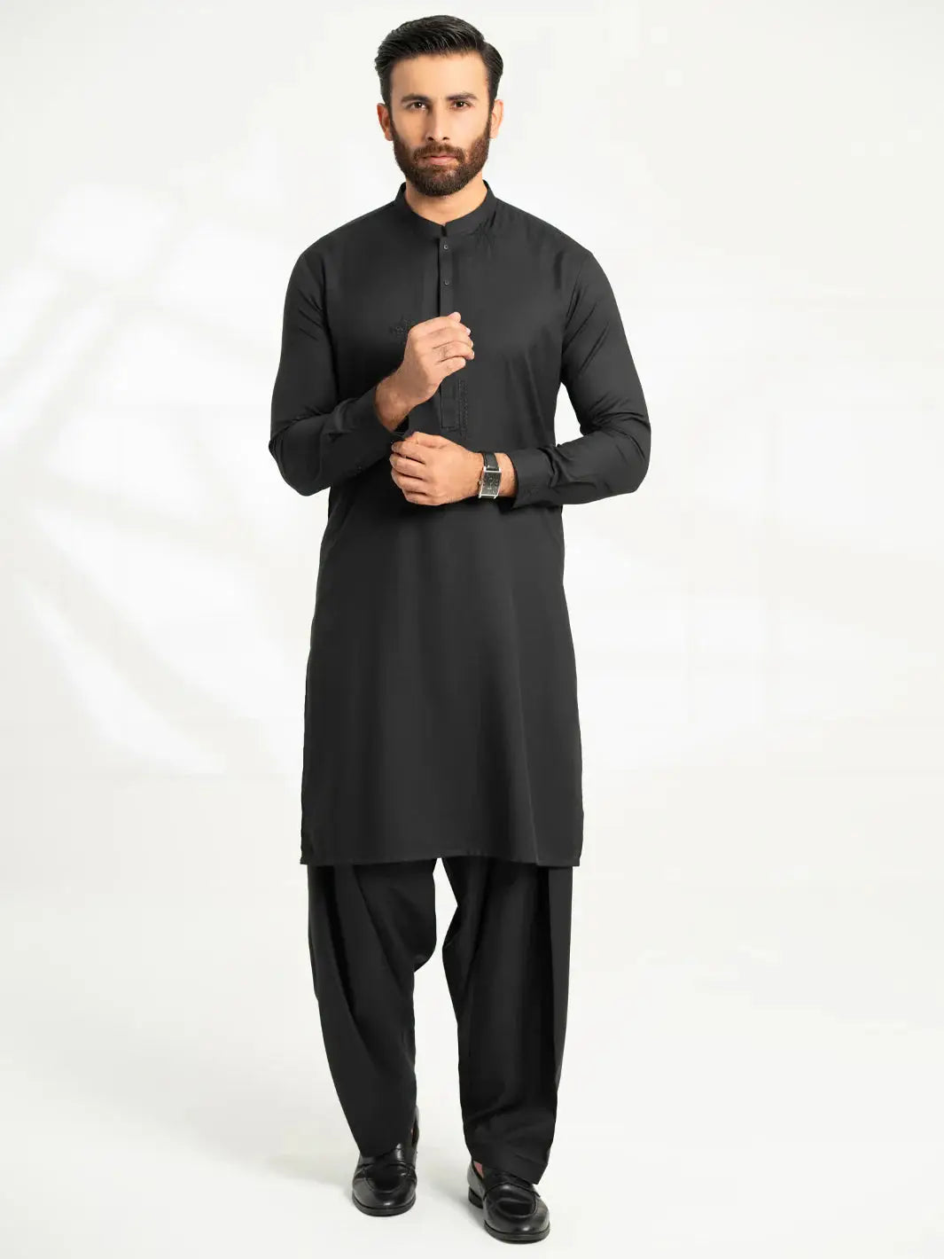 Men's black kurta with matching shalwar, formal attire for men
