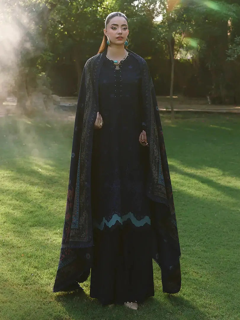 Model in RANGREZA AL-1127 dark embroidered outfit with full-length wool shawl, styled for sophisticated Pakistani winter fashion.