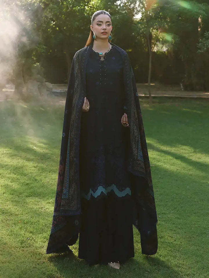 Model in RANGREZA AL-1127 dark embroidered outfit with full-length wool shawl, styled for sophisticated Pakistani winter fashion.