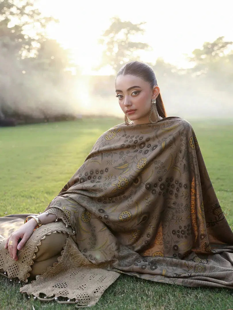 Model seated in RANGREZA | AL-1129 showcasing the full wool shawl design and lace-detailed trousers in a serene outdoor setting.