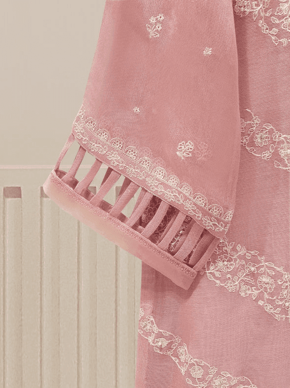 Detailed sleeve embroidery on pink shirt