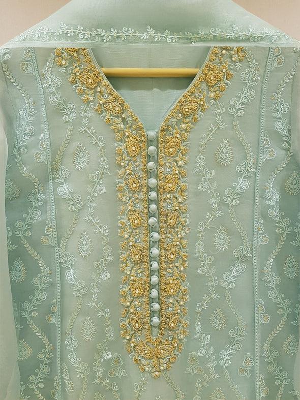 Close-up of intricate embroidery on shirt neckline