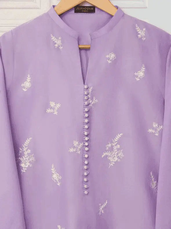 Close-up of Agha Noor shirt with pearl buttons