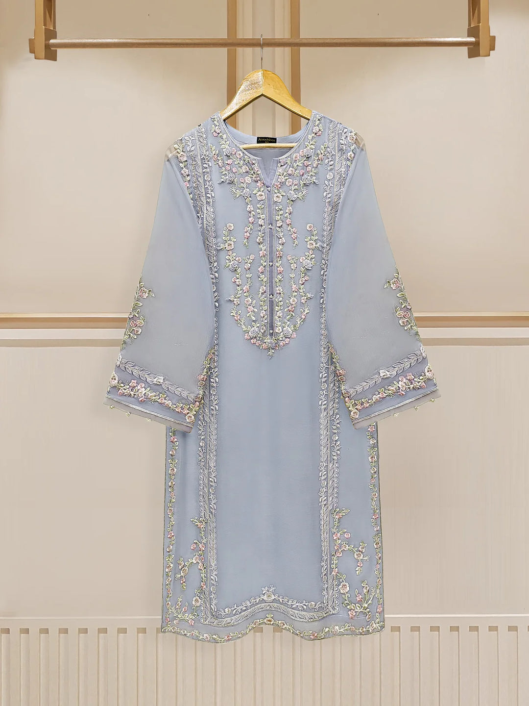 Front view of embroidered chiffon suit on hanger