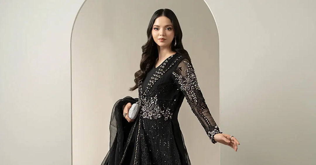 Model wearing 3 Piece Embroidered Suit - Black Long Dress Organza with embellished bodice and sheer dupatta, perfect for festive wear.