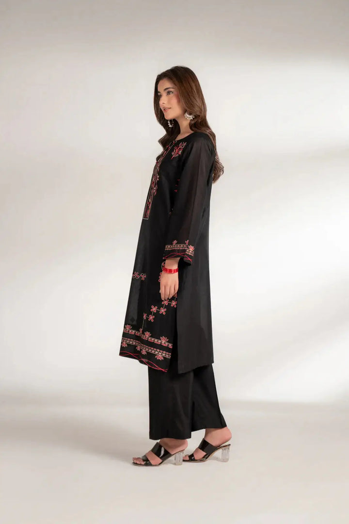 Side profile of INARA Lawn Shirt - Pakistani Embroidered Shirt in black, highlighting side slit and detailed embroidery on sleeves and hem.