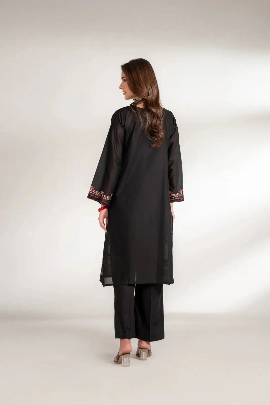 Back view of INARA Lawn Shirt - Pakistani Embroidered Shirt in black, showcasing plain back design with embroidered sleeve cuffs.