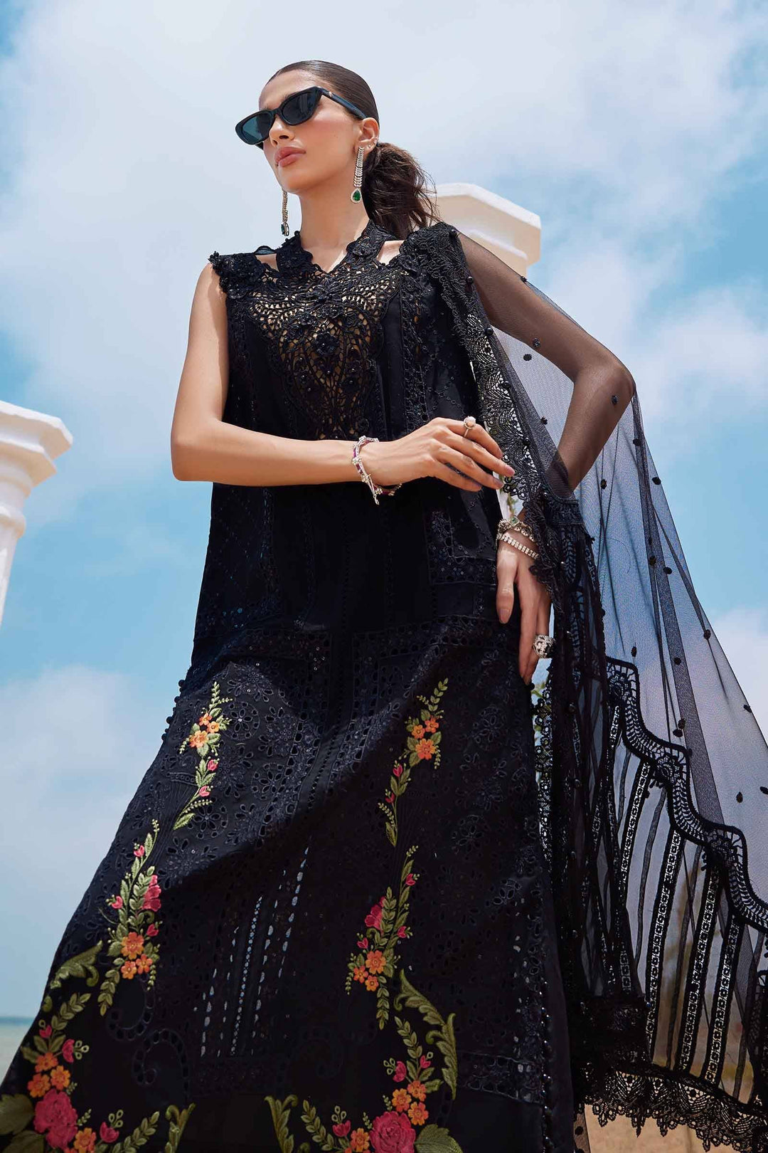 Model wearing embroidered 3-piece Pakistani lawn suit AL-4296 with black dupatta and floral pants, styled for elegant formal wear.
