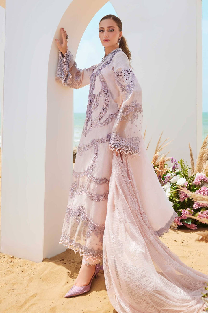 Full view of 3 piece suit women's Embroidered Lawn Suit | AL-4309 with cambric trousers and flowing dupatta in a pastel beach setting.
