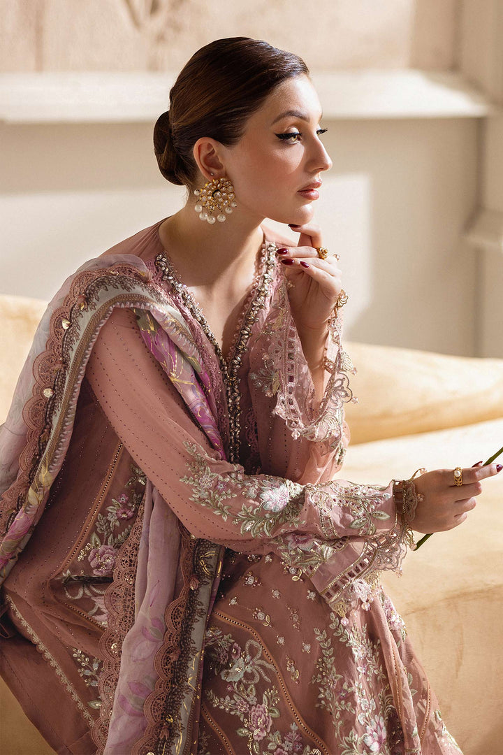 Side profile of model in MARIA.B MPC-25-105 luxury chiffon suit with hand embellishments and floral dupatta in soft pastel tones.