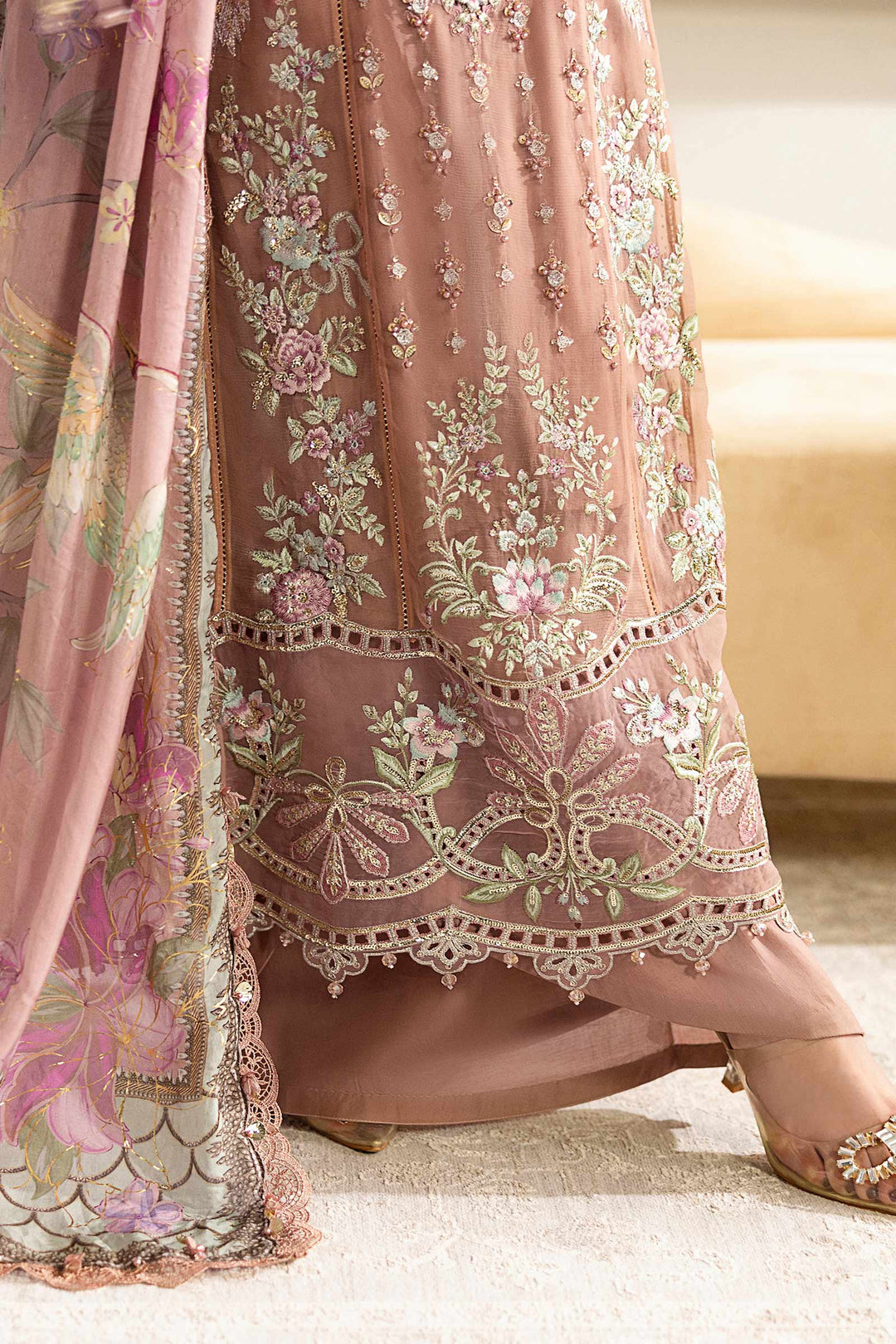 Lower half of MARIA.B MPC-25-105 chiffon suit showing intricate hem embroidery and floral motifs with scalloped lace finish.