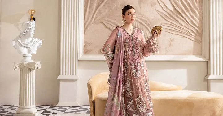 Elegant setting with model in MARIA.B MPC-25-105 luxury 3 piece chiffon suit, styled with floral silk dupatta and gold accessories.