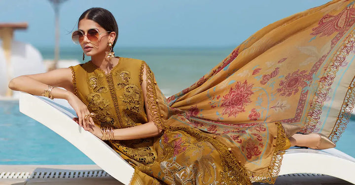 Model lounging in Embroidered Lawn - women's 3 piece suit | Wedding & Festive Wear with flowing dupatta and intricate embroidery perfect for formal events.