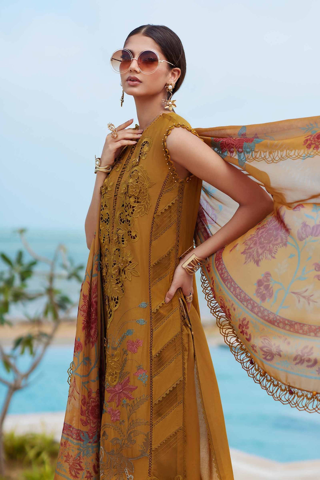 Side view of Embroidered Lawn - women's 3 piece suit | Wedding & Festive Wear with flowing organza dupatta and detailed embroidery on mustard shirt.