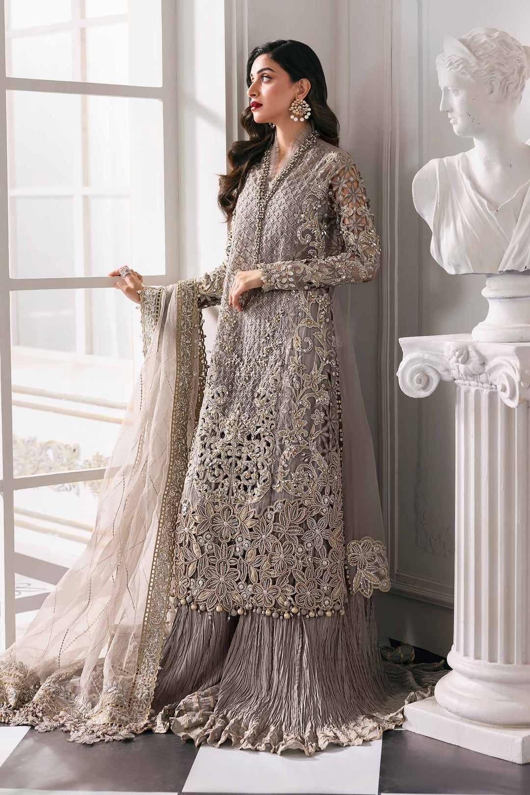 Elegant pose in Embroidered Organza Stitched 3-Piece Outfit Luxury | AL-4232 featuring gold threadwork and sheer dupatta for upscale fashion.