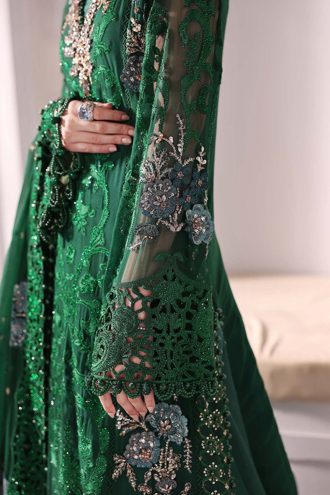 Detailed sleeve view of AL-4230 green chiffon suit showing intricate lacework, floral embroidery, and bead accents for a luxurious finish.