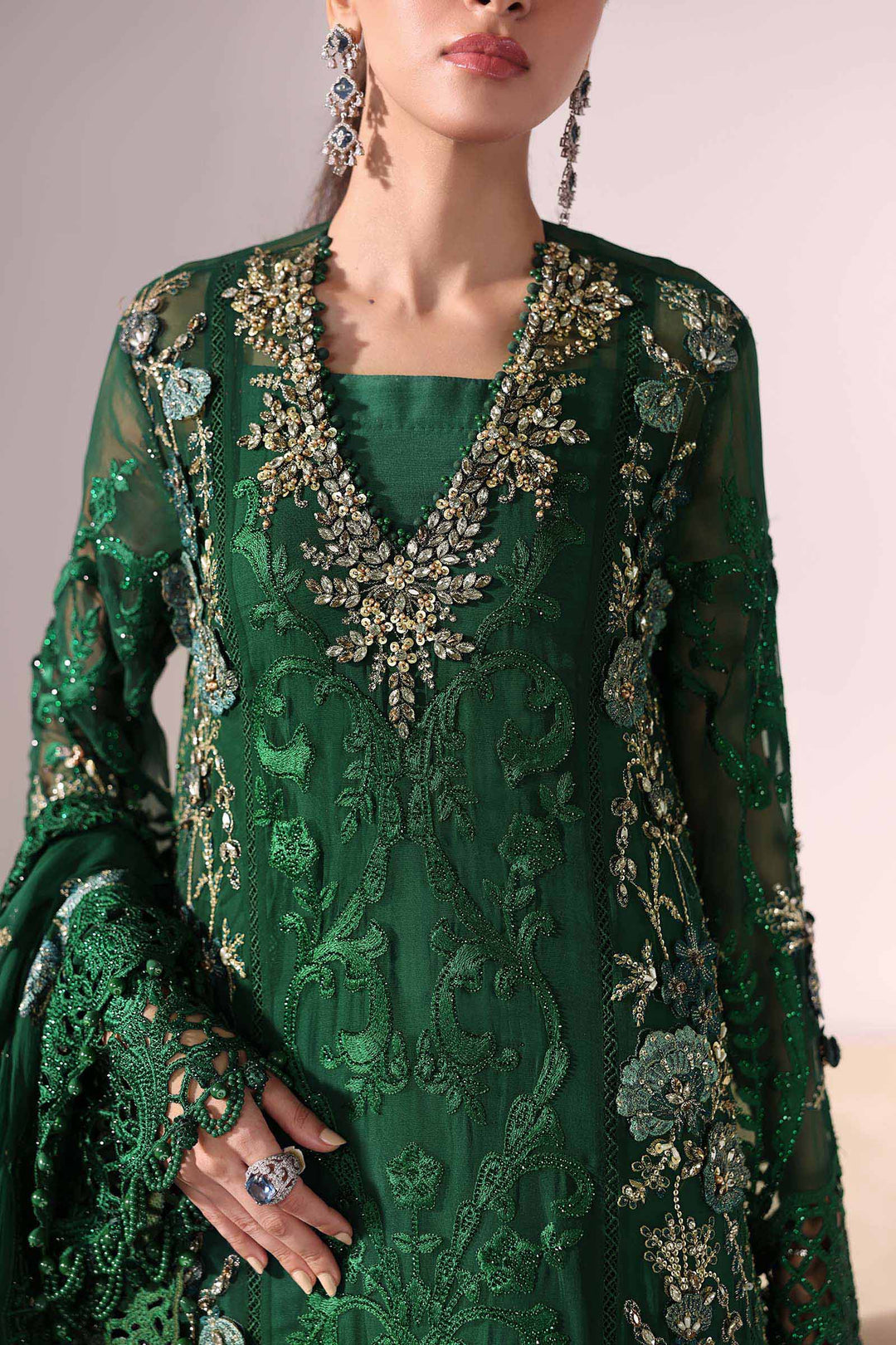 Neckline close-up of AL-4230 green chiffon dress with heavy embroidery, pearl detailing, and floral embellishments for a premium festive look.