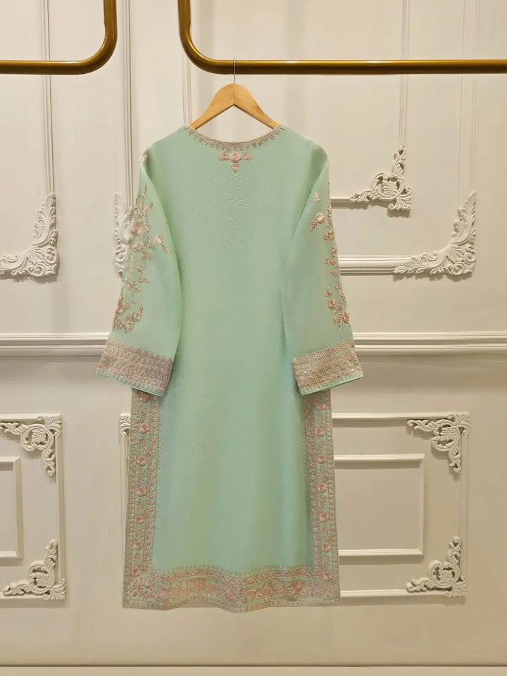 Back view of AGHA NOOR 2 Piece Cotton Suit showcasing minimal embroidery on mint green cotton net, perfect for elegant traditional styling.