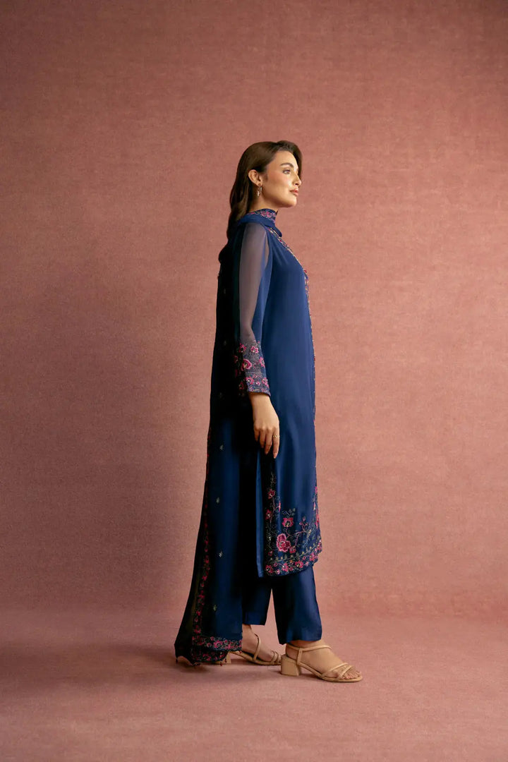 Side view of CHINYERE 3 Piece Chiffon Embroidered Suit showcasing elegant floral embroidery on sleeves and hem, ideal for festive wear.